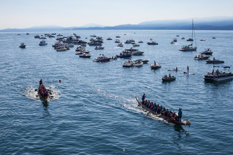 Paddlers power their huge canoes on Montana's Flathead Lake during a race in the 2012 Montana Dragon Boat Festival. (Courtesy photo)