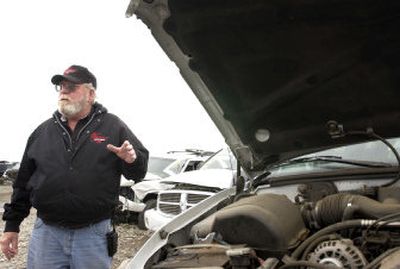 
Lavoy Jacobsen, a supervisor with Spalding Auto Parts in Spokane Valley, talks about mercury light switches in Spalding's domestic vehicle lot Tuesday. 
 (Photo by JOE BARRENTINE / The Spokesman-Review)