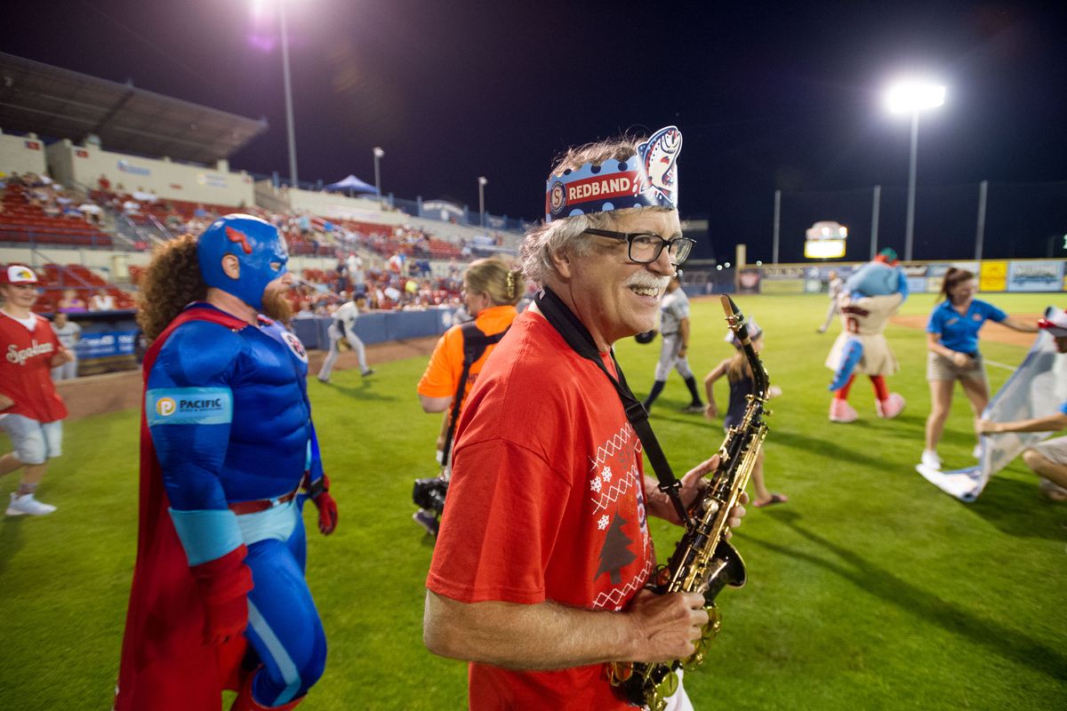 Charlie Butts smiles as he heads to the field to play “Take Me Out to the Ballgame” during the seventh-inning stretch as the Spokane Indians face off against the Everett AquaSox on July 25, 2017, at Avista Stadium.  (Tyler Tjomsland/The Spokesman-Review)