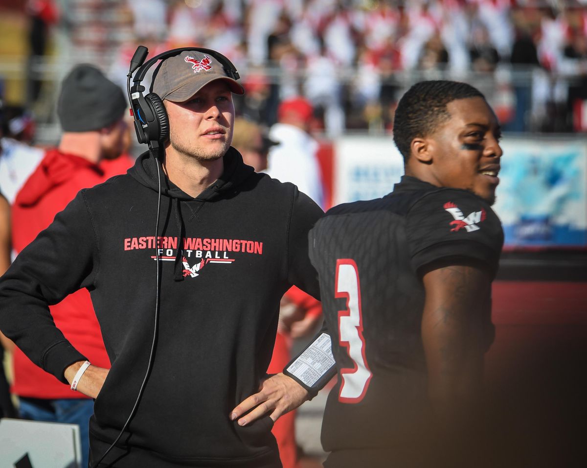 Injured Eastern Washington quarterback Gage Gubrud, left, and starting QB Eric Barriere watch the third-quarter action against Idaho last Saturday in Cheney. (Dan Pelle / The Spokesman-Review)