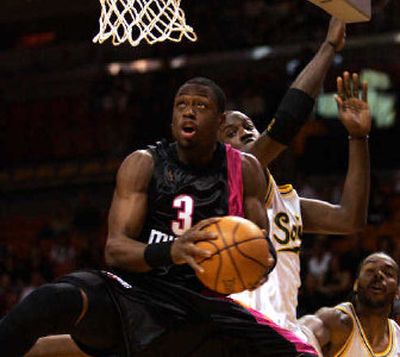 
Dwyane Wade of the Miami Heat has his eyes on the prize. Wade finished with 26 points in win.
 (Associated Press / The Spokesman-Review)