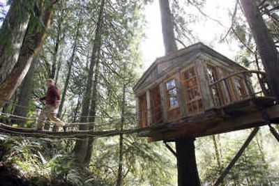 
Pete Nelson walks across a bridge  of one of his projects in Fall City, Wash. Seattle Times
 (THOMAS JAMES HURST Seattle Times / The Spokesman-Review)