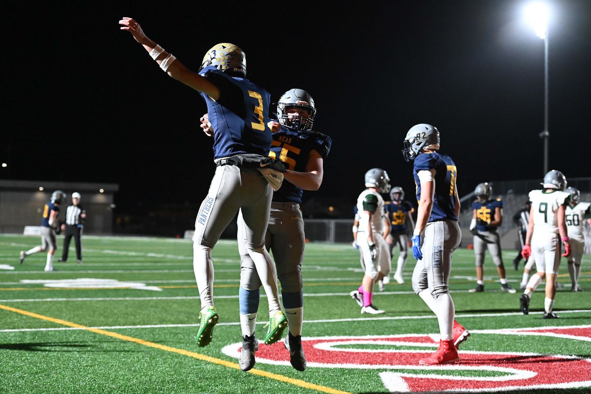 Mead Panthers Jaeland Leman (3) and Mead Panthers Chase Sander (55) celebrate a touchdown against the Ridgeline Falcons during the first half at Union Stadium on Fri. Oct. 10, 2024 in Spokane WA.  (James Snook/For The Spokesman-Review)