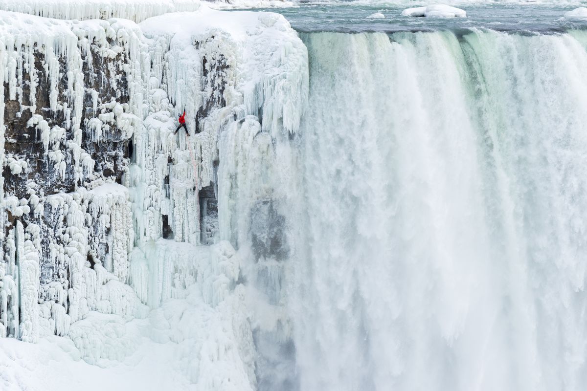 Will Gadd ice climbs the first ascent of Niagara Falls in Niagara Falls, New York, on Jan. 27, with help from New York State Parks Department and park police.