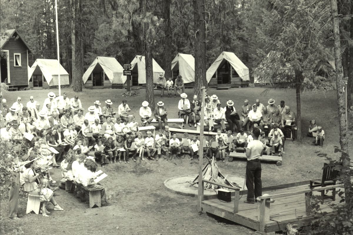 Singing around the campfire has been a long tradition at Camp Gifford, as shown here in the 1950s.