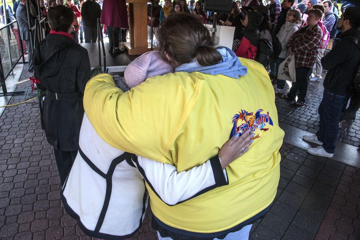 EWU student Dulce Gutierrez Vasquez, left, is embraced by Amanda Mell after Gutierrez Vasquez addressed the crowd on the Cheney, Wash., campus mall during the Unity Rally hosted by the Multicultural Coalition of Eastern Washington University. (Dan Pelle / The Spokesman-Review)