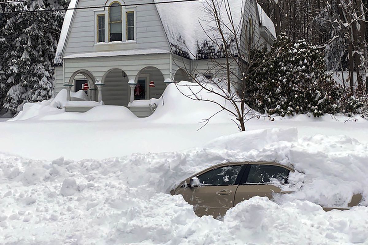 CORRECTS CITY TO OWEGO, N.Y. This photo, provided by the New York State Police, shows a car, in Owego, NY, from which a New York State Police sergeant rescued Kevin Kresen, 58, of Candor, NY, stranded for 10 hours, covered by nearly 4 feet of snow thrown by a plow during this week