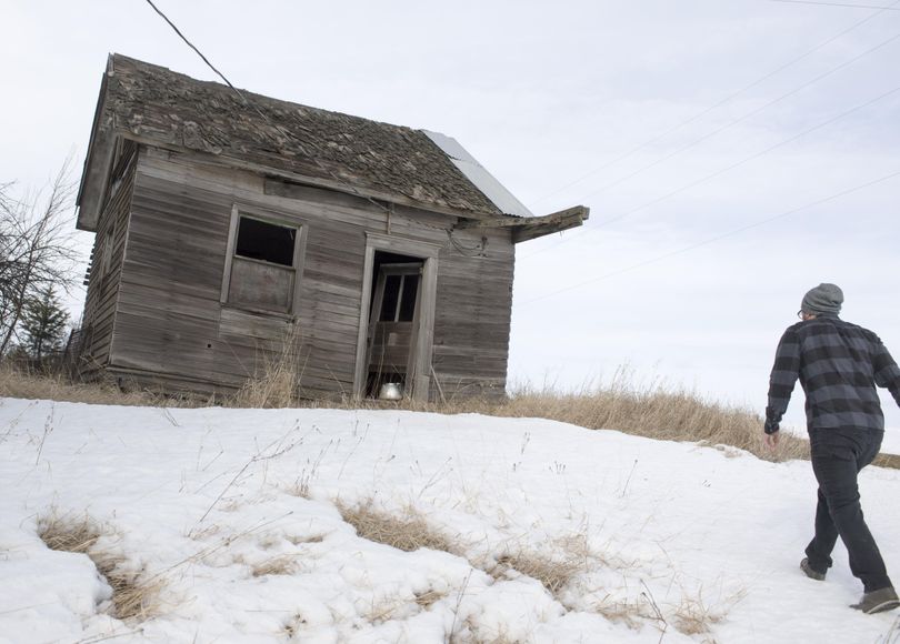 Jeff Torres, who calls himself an explorer, approaches an old farm building on the Palouse during an outing, Monday, Jan. 30, 2017. Jeff has a popular YouTube channel where he posts  videos of his adventures exploring abandoned places. (Jesse Tinsley / The Spokesman-Review)