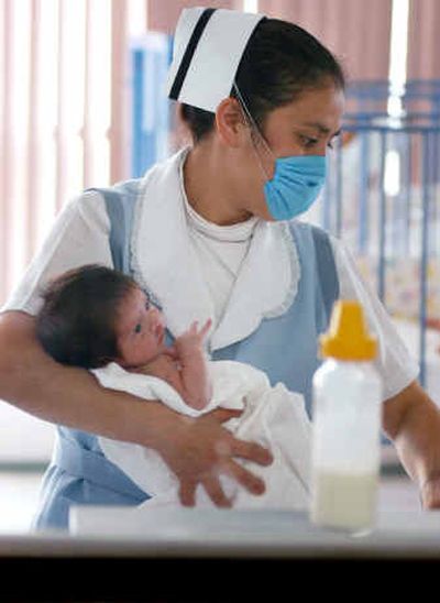 
Nursing student Sandra Barboa cares for a baby at the nursing school of the National Cardiology Institute in Mexico City, Mexico. The United States is recruiting Mexican health care workers.
 (Associated Press / The Spokesman-Review)