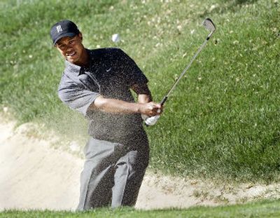 
A master of many shots, Tiger Woods hits out of the bunker during last week's Target World Challenge at the Sherwood Country Club in Thousand Oaks, Calif. 
 (Associated Press / The Spokesman-Review)