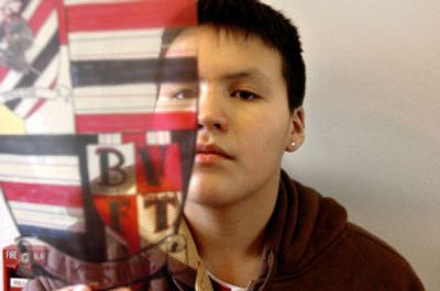 
Aaron Garcia, a freshman at Lakeside High School, holds a transparency of a shield, his entry in a school contest to design a new Lakeside crest. 
 (Photos by Jesse Tinsley/ / The Spokesman-Review)