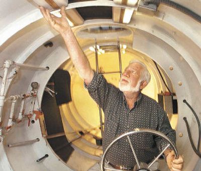 
Dan Taylor turns on an overhead light last year inside the hull of Nessa, a 44-foot submarine designed to plummet the depths of Loch Ness, Scotland, in search of the mythical beast, Nessie, in Hardeeville, S.C.
 (Associated Press / The Spokesman-Review)