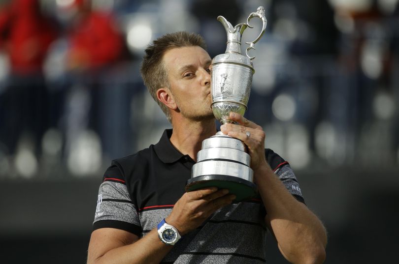 Henrik Stenson of Sweden kisses the trophy after winning the British Open Golf Championship at the Royal Troon Golf Club in Troon, Scotland, Sunday, July 17, 2016. (Matt Dunham / Associated Press)