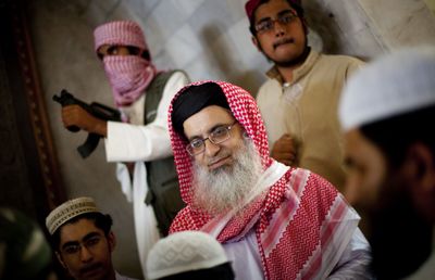 Maulana Abdul Aziz, chief cleric of Islamabad’s radical Red Mosque, addresses his supporters inside the mosque during Friday prayers.  (Associated Press / The Spokesman-Review)