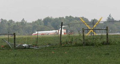 
The end of runway 26 is blocked where Comair 5191 crashed through the fence on Sunday  in Lexington, Ky. 
 (Associated Press / The Spokesman-Review)