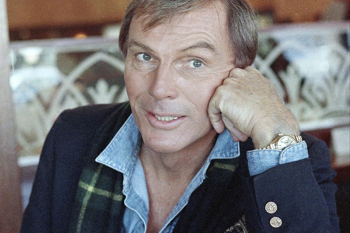 FILE - In this Dec. 11, 1985 file photo, Adam West poses for a photo in Los Angeles. On Saturday, June 10, 2017, his family said the actor, who portrayed Batman in a 1960s TV series, has died at age 88. (Lennox Mclendon / Associated Press)