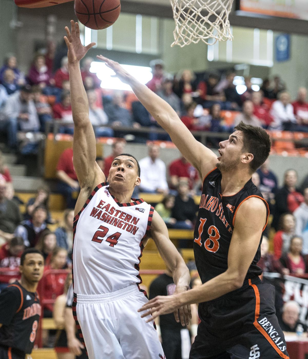 Eastern Washington forward Jacob Wiley powers past Idaho State center Novak Topalovic for a basket in the first half, Feb. 25, 2017, in Cheney. (Dan Pelle / The Spokesman-Review)