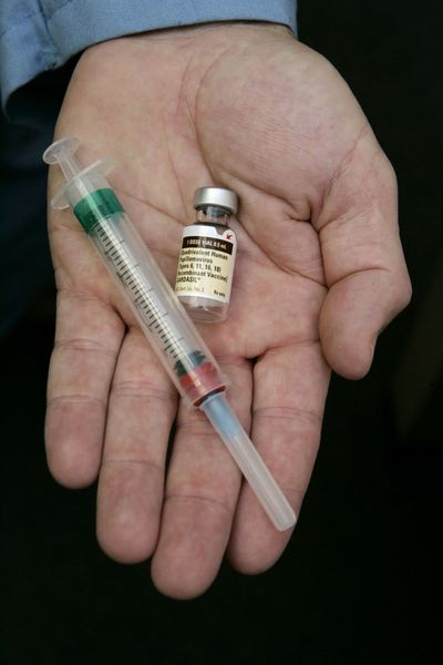 This photo shows Dr. Donald Brown holding the human papillomavirus vaccine Gardasil in his hand at his Chicago office. Dr. Meg Fisher says the American Academy of Pediatrics recommends that girls get the human papillomavirus vaccine, which protects against cervical cancer. (Associated Press / The Spokesman-Review)