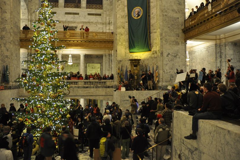 Protesters fill the Capitol rotunda around the Christmas tree the evening of Day 1 of the Legislature's special session. (Jim Camden)