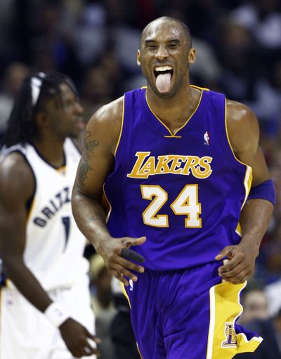 Kobe Bryant reacts after a second-half 3-pointer against Memphis on Monday makes him the Lakers’ all-time leading scorer.  (Associated Press)