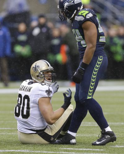 Bobby Wagner, right, and Seahawks defense grounded Saints’ Jimmy Graham. (Associated Press)