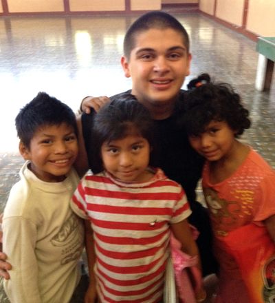 Austin Friedly, a senior at Northwest Christian School, poses for a photo with children from an orphanage in Nicaragua. Friedly has been to Nicaragua three times, twice to work in orphanages.
