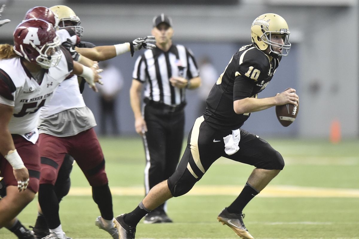 Idaho Vandals quarterback Matt Linehan (10) runs the ball for a first down against New Mexico State during a college football game on Saturday, Oct 15, 2016, at the Kibbie Dome in Moscow, ID. (Tyler Tjomsland / The Spokesman-Review)