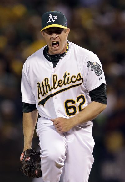 Oakland Athletics reliever Sean Doolittle struck out the Detroit Tigers in order in the eighth inning of Game 3 of the American League division baseball series in Oakland. (Associated Press)