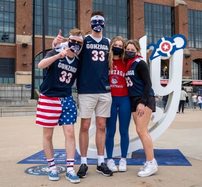 Left to right, Gonzaga students Jeremy Thellman, Cade Sanders, Rylie Clark and Sarah Smith pose for a photo Tuesday before going into the Lucas Oil Stadium to watch the Zags play USC in the NCAA Tournament’s Elite Eight in Indianapolis.  (COLIN MULVANY/THE SPOKESMAN-REVIEW)