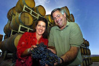 
Vicki and Craig Leuthold hold freshly picked merlot grapes at their Maryhill Winery in Goldendale, Washington. Once partners in the local Fort Spokane Brewery operation, they have gotten away from microbrew beer to focus on premium wines. 
 (Christopher Anderson/ / The Spokesman-Review)