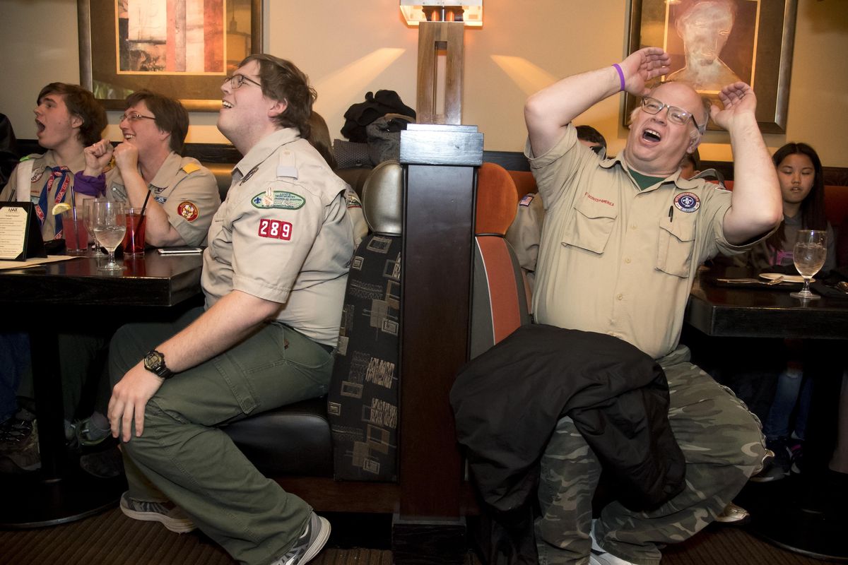 William Baures, left and Kenneth Rouse react to a scene from the Fox reality TV show “Kicking and Screaming” during a watch party at the Max Lounge at the Mirabeau Park Hotel Thursday, April 13, 2017. (Colin Mulvany / The Spokesman-Review)