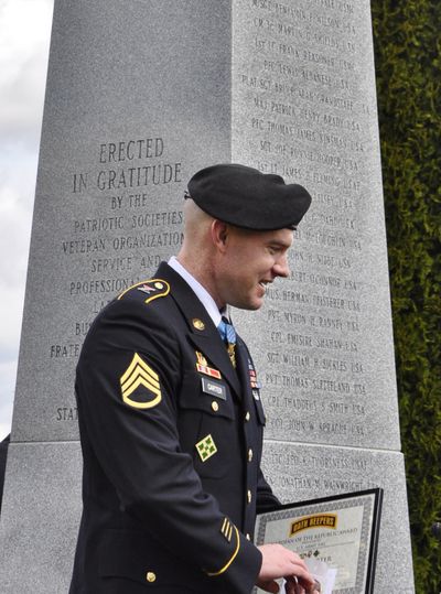 Staff Sgt. Ty Carter stands in front of the state Medal of Honor Monument, which now includes his name. (Jim Camden)