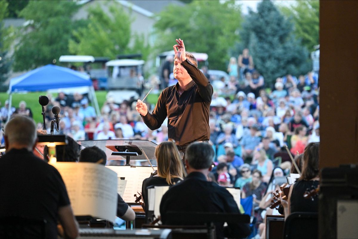 Spokane Symphony Conductor and Music Director James Lowe leads the symphony for a free Saturday concert at Liberty Lake’s Pavillion Park where an estimated 2,000 people attended.  (Jesse Tinsley/The Spokesman-Review)