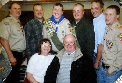 
Albert and Katherine Wallace sit with their Eagle Scout sons gathered around them. From left are James, Matthew, Jacob, David, Albert and Robert Wallace. 
 (Courtesy of family / The Spokesman-Review)