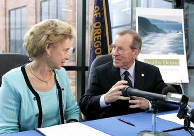 
Washington Gov. Chris Gregoire and Oregon Gov. Ted Kulongoski talk Monday as they await a satellite link with California. Gregoire said an agreement to improve the Pacific Ocean's health 