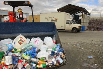
Beau Rich of Spokane Recycling Products takes recyclables to the sorting area, where plastics, cans and paper will be sorted. 
 (Kathryn Stevens / The Spokesman-Review)
