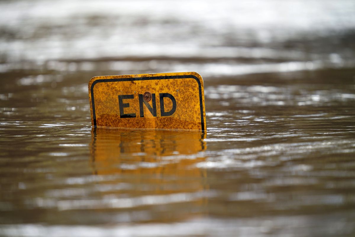 A boat ramp sign is submerged in the Tar River as it rises following a heavy rain in Princeville, N.C., Thursday, March 17, 2022. The river continues to be a threat to the small community nestled in the flood plain of the Tar River. (Gerry Broome)
