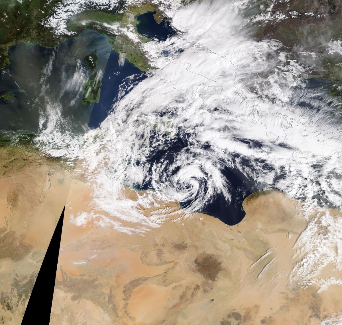 A medicane swirls toward Libya on Tuesday. (NASA WorldView) 