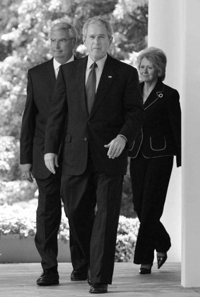 
President Bush,  Transportation Secretary Mary Peters, right, and EPA Administrator Stephen Johnson walk  to the White House Rose Garden on Monday. 
 (Associated Press / The Spokesman-Review)