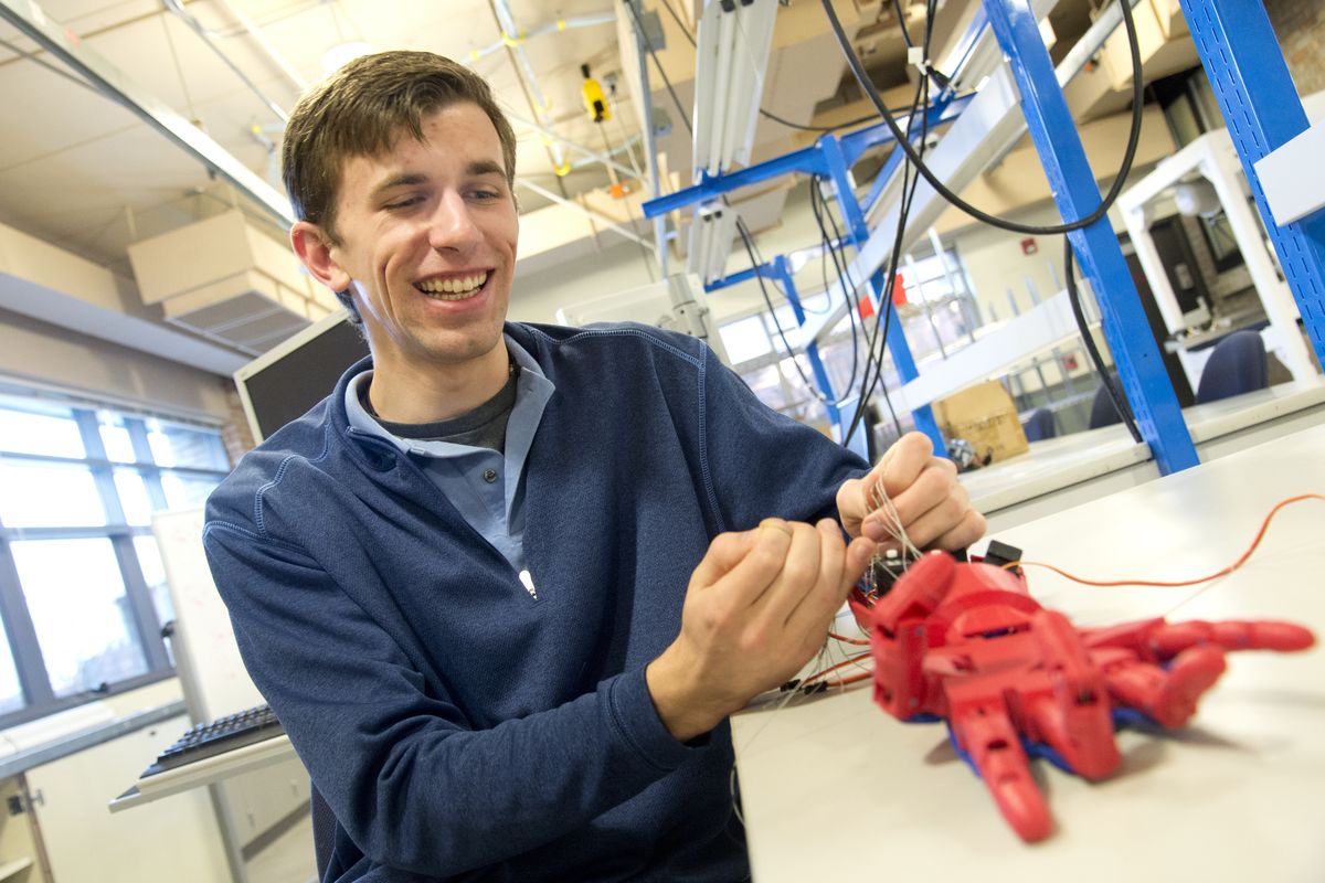 Chris Birmingham demonstrates the mechanical hand that is one of the first projects of the Robotics Club at Gonzaga University on Thursday. Birmingham, an electrical engineering major who helped start the club, was recently awarded the Marshall Scholar Prize, which comes with two years of paid postgraduate education in England. (Jesse Tinsley)