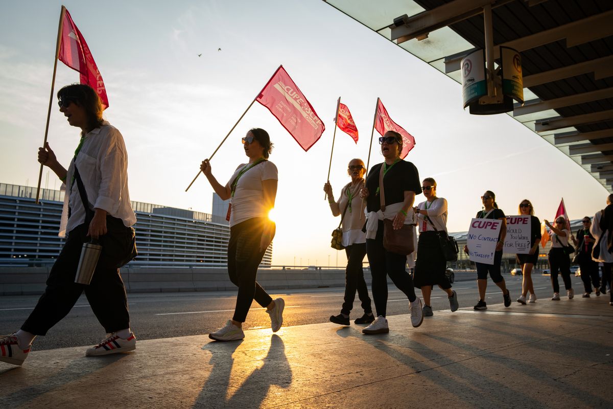 Air Canada flight attendants and supporters demonstrate during a strike Saturday at Toronto Pearson International Airport in Mississauga, Ontario. (Bloomberg)
