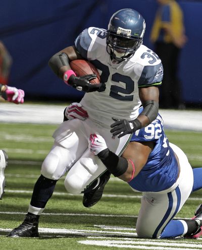 Edgerrin James is raising his kids alone after the death of his longtime girlfriend in April. (Associated Press / The Spokesman-Review)