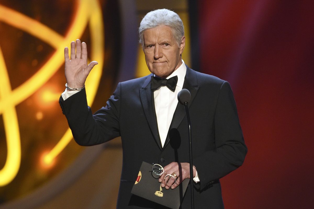 FILE - This May 5, 2019, file photo shows Alex Trebek gestures while presenting an award at the 46th annual Daytime Emmy Awards in Pasadena, Calif. Jeopardy!” host Alex Trebek died Sunday, Nov. 8, 2020, after battling pancreatic cancer for nearly two years. Trebek died at home with family and friends surrounding him, “Jeopardy!” studio Sony said in a statement. Trebek presided over the beloved quiz show for more than 30 years. (Chris Pizzello)