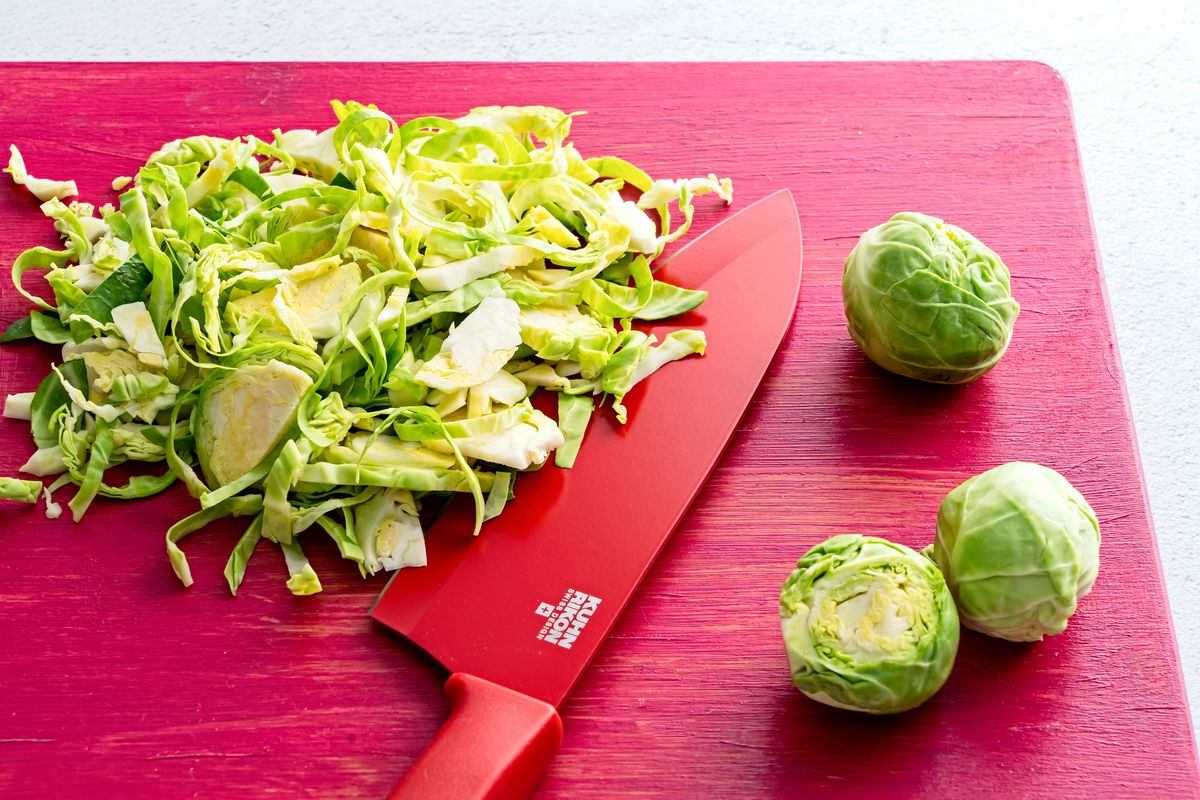 Brussels sprouts are shredded for chile shrimp with Brussels sprouts and lemon aioli.  (Scott Suchman/For the Washington Post)