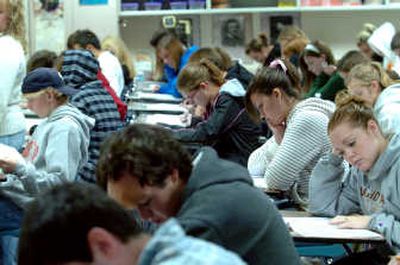 
Coeur d'Alene High students hunch over the PSAT test Wednesday morning. More than 400 CHS students took the PSAT, Compass or ASVAB test this year. 
 (Jesse Tinsley / The Spokesman-Review)