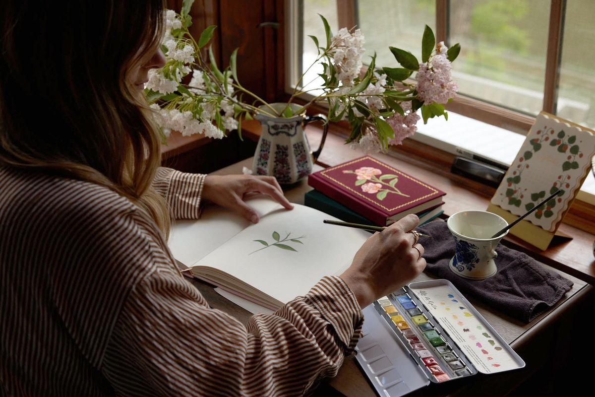 Anna Bond paints flowers as part of the wallpaper-creating process. MUST CREDIT: Rifle Paper Co.  (Rifle Paper Co./Rifle Paper Co.)