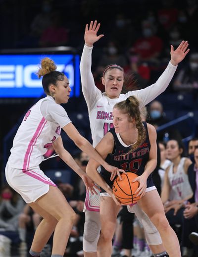 Gonzaga guards McKayla Williams, left, and Cierra Walker double-team Saint Mary’s guard Tayla Dalton on Feb. 17, 2021, at McCarthey Athletic Center.  (COLIN MULVANY/THE SPOKESMAN-REVIEW)