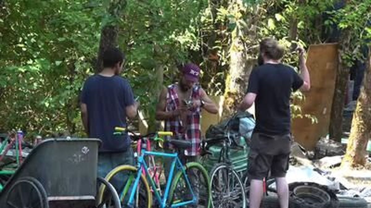 Volunteers handed out water to homeless people in Portland, Oregon, on Thursday as the Pacific Northwest entered the peak days of a scorching heat wave in the usually temperate region. 