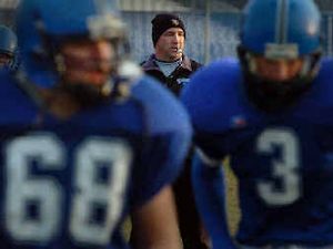 
CdA football coach Shawn Amos puts his team through warm-up drills Tuesday in preparation for Friday's state semifinal game.
 (Jesse Tinsley / The Spokesman-Review)