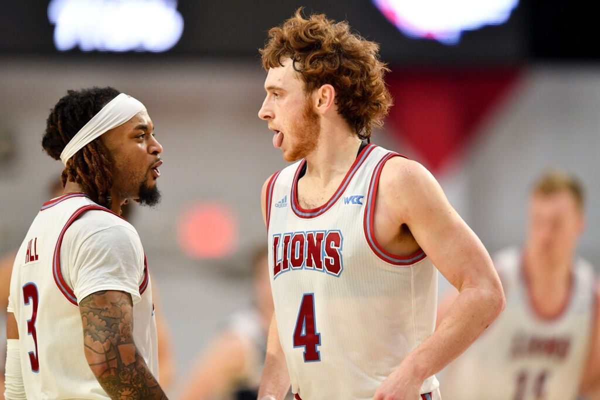 Loyola Marymount’s Will Johnston, right, and Justice Hill celebrate a bucket against Gonzaga during the second half Thursday at Gersten Pavilion in Los Angeles.  (Tyler Tjomsland / The Spokesman-Review)